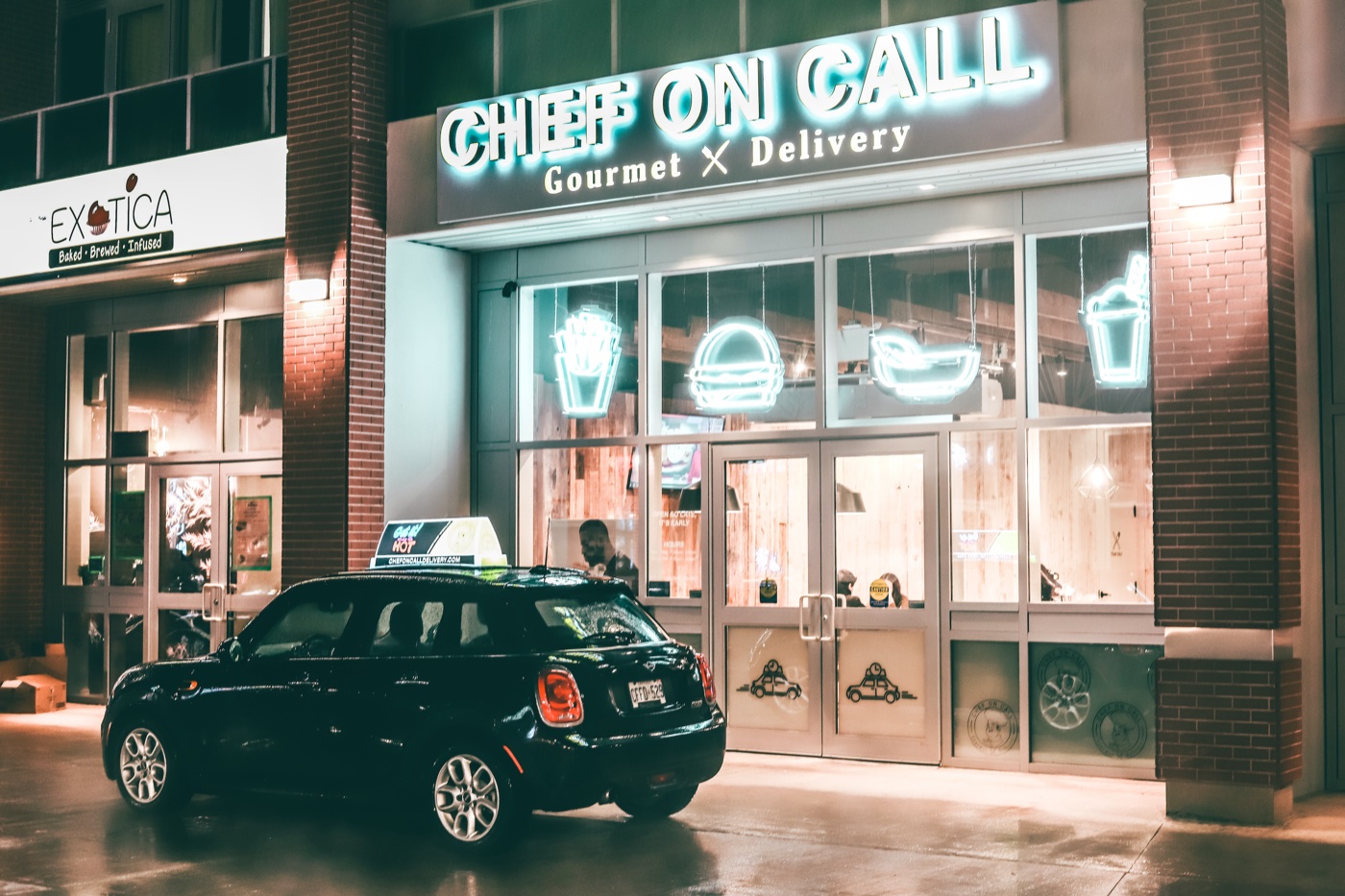 Chef On Call Waterloo storefront at night — neon signs, delivery car out front