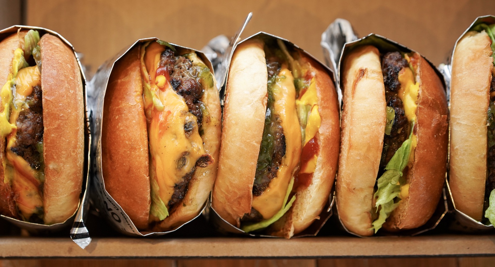 Row of hand-pressed Chef On Call burgers