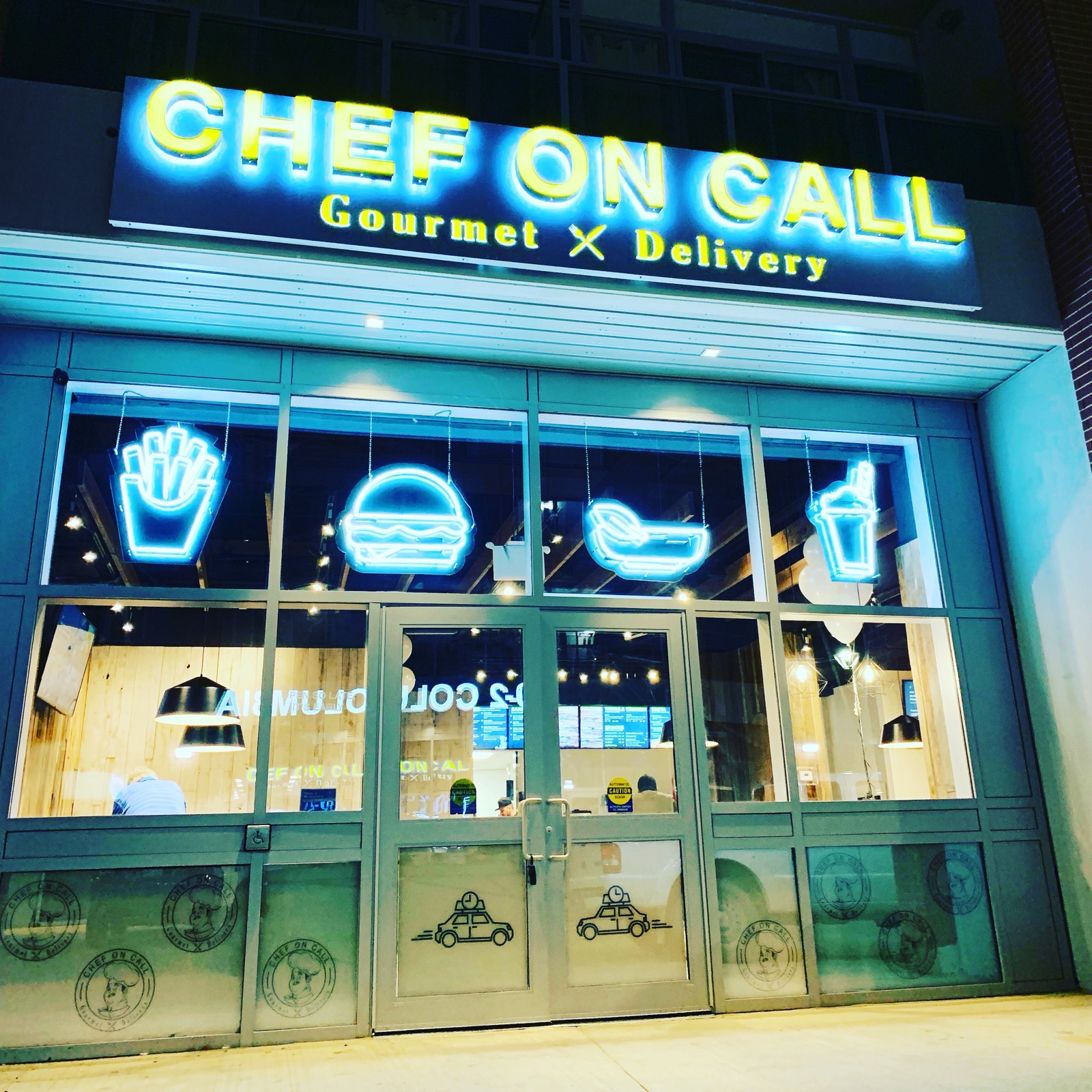 Chef On Call Waterloo neon storefront at night